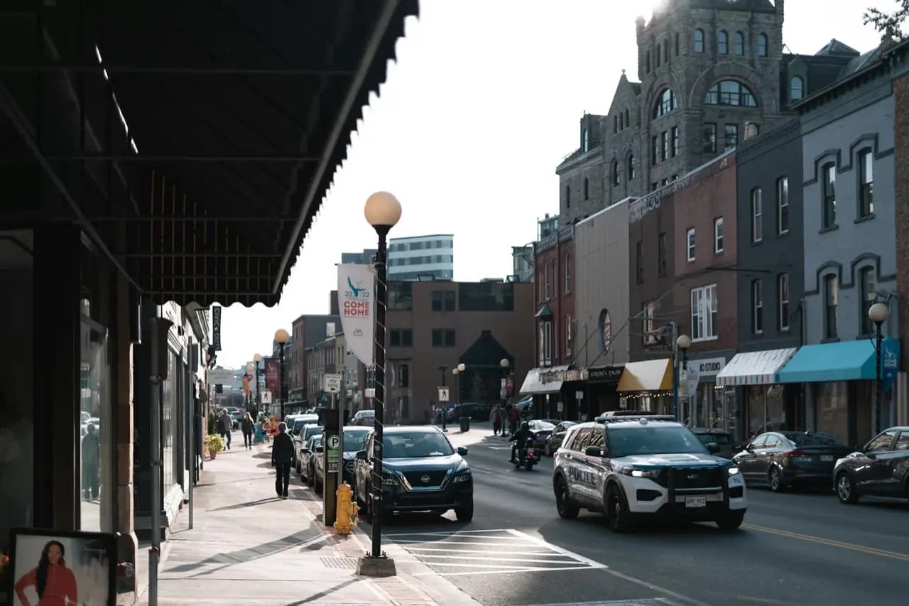 Downtown Kingston, Ontario main street with heritage limestone buildings — lawn care service area
