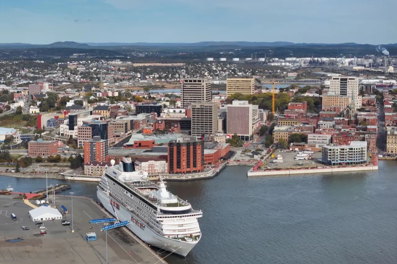 Saint John, New Brunswick harbour city with church spires and waterfront — lawn care service area
