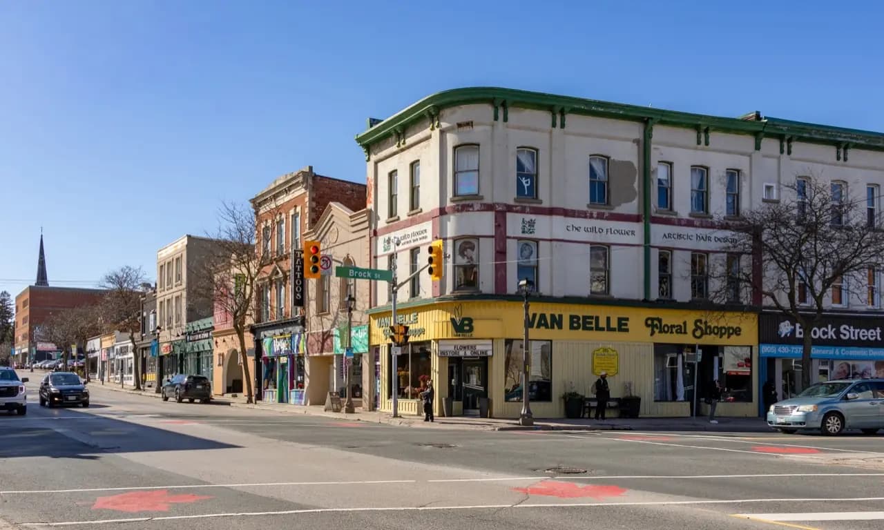 Downtown Whitby, Ontario Brock Street with heritage storefronts — lawn care service area