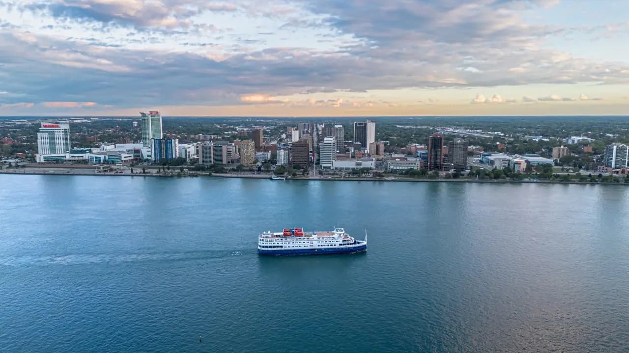 Windsor, Ontario waterfront skyline on the Detroit River with ferry — lawn care service area